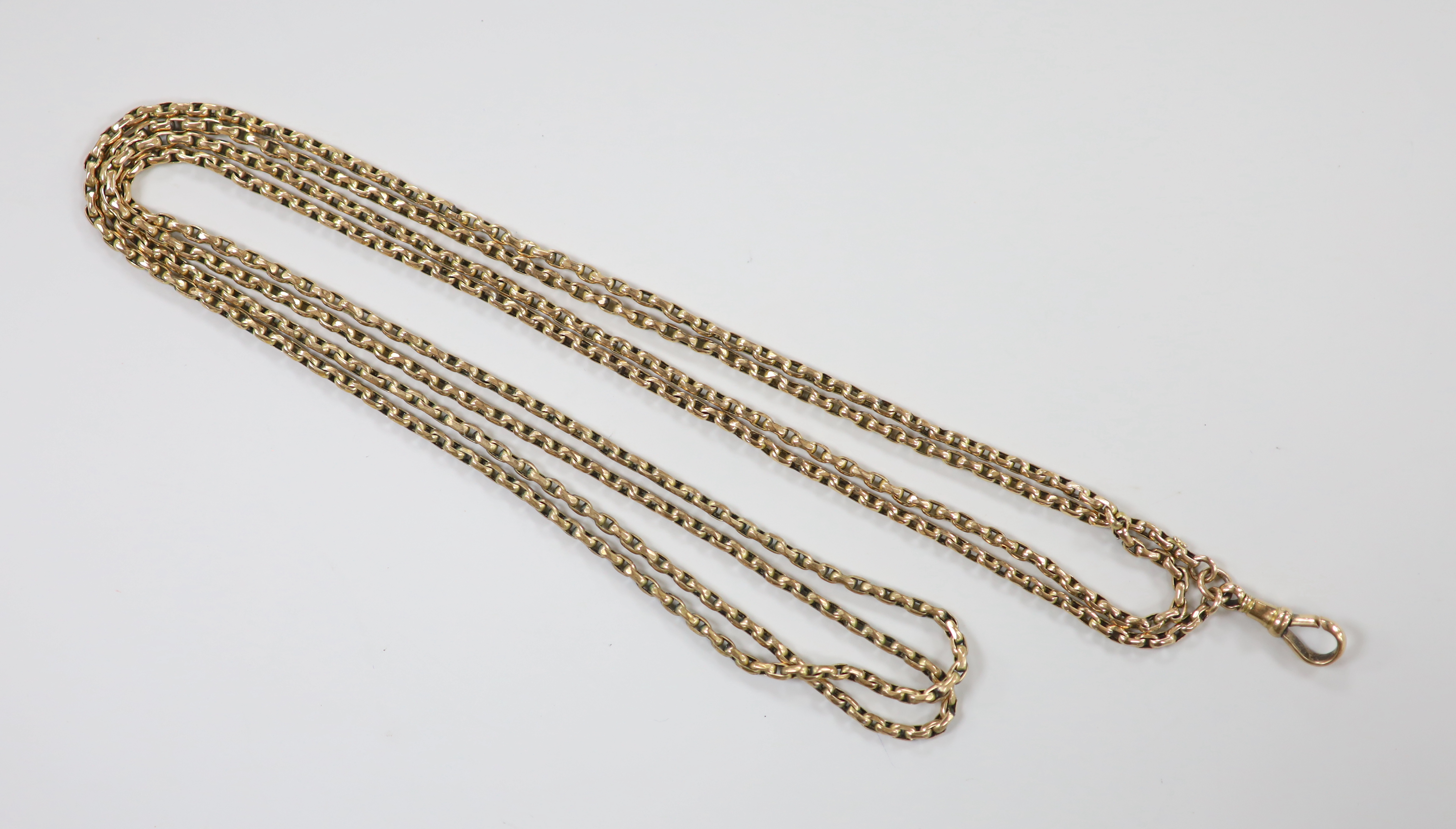 A late Victorian 9ct guard chain, 148cm, 26 grams.